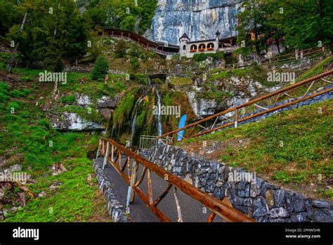 Waterfall flowing from St. Beatus Caves in Switzerland Stock Photo - Alamy