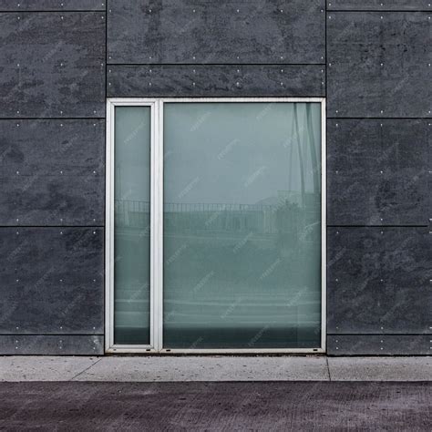 Free Photo | Front view of glass window in a city building