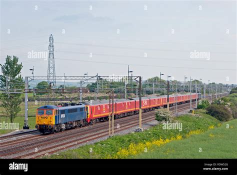 A pair of class 87 electric locomotives numbers 87028 and 87022 top and tailing a rake of class ...