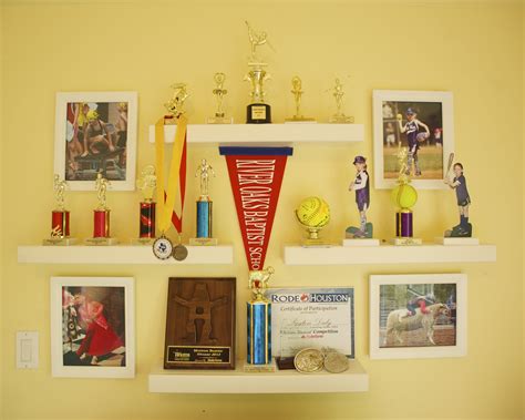 Trophy display, Hayden Simply White Ledge shelves from Pottery Barn Kids, photos incorporated ...