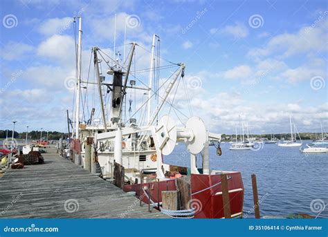 Commercial Fishing Boats By A Wood Dock Stock Images - Image: 35106414