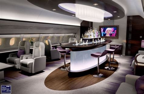 the interior of an airplane with bar and seating