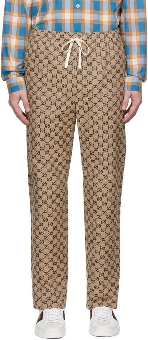 Gucci: Beige & Navy Canvas GG Trousers | SSENSE