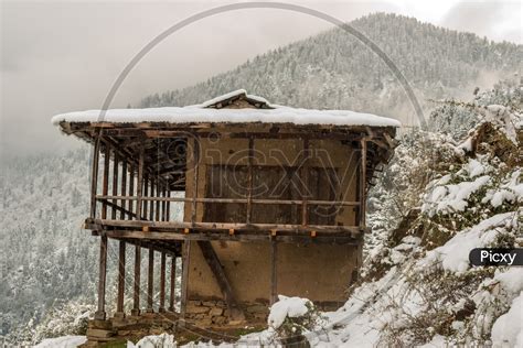 Image of Wooden Houses of Himachal Pradesh Covered with Snow in Winter with Mountains in ...