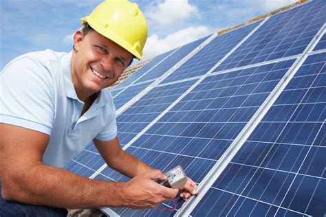 Man installing solar panels for solar power - Energy Optimizers, USA