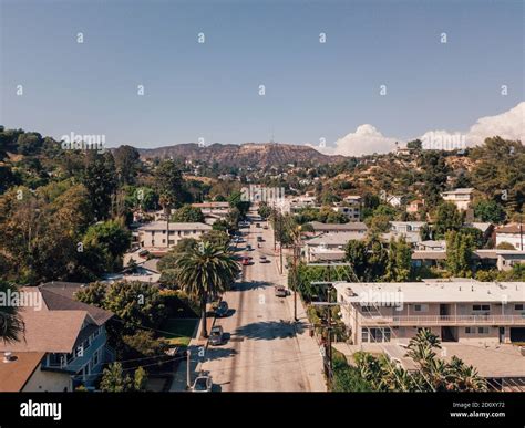 Aerial shot of Hollywood sign over the buildings in Los Angeles ...