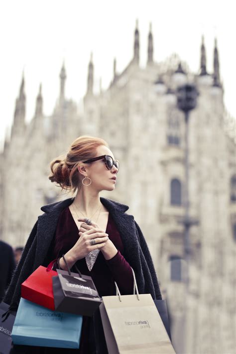 Shallow Focus Photography of Woman Holding Assorted-color Paper Bags ...