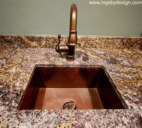 Orite Granite with a Leathered Finish on a Theater Bar. Hammered Copper undermount bar sink ...