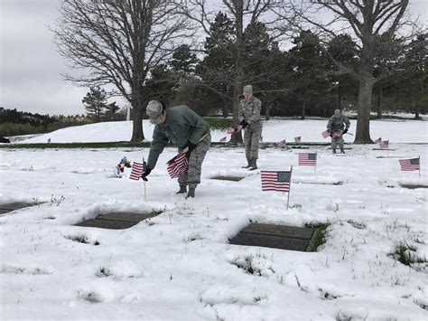 Team Pete Airmen place flags at U.S. Air Force Academy Cemetery for Memorial Day