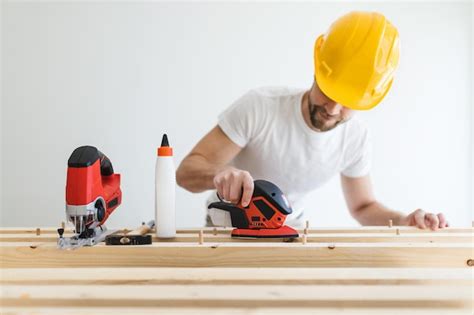 Premium Photo | Male carpenter working on a project