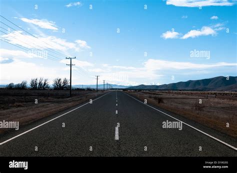 Paved road in rural landscape Stock Photo - Alamy