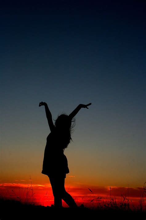 Royalty-Free photo: Photography of woman raising her hands during ...