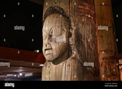 Old preserved Kasaan of the Haida Nation with a human native face exhibited in the Totem ...