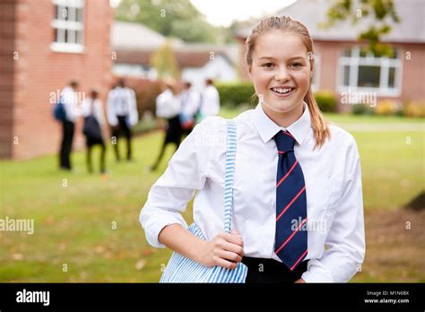 Portrait Of Female Teenage Student In Uniform Outside Buildings Stock ...