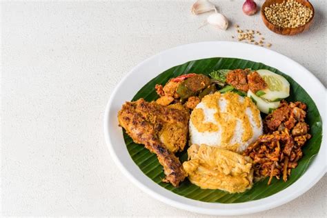 Premium Photo | Nasi padang with chicken rendang is an indonesian food ...