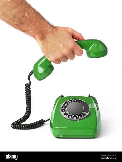 Hand holding an old telephone receiver Stock Photo - Alamy