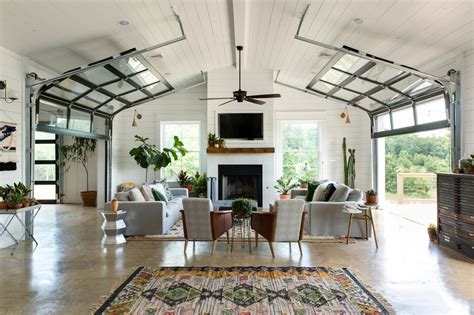 Living area in a converted barn features polished concrete floors and du… | Farm house living ...