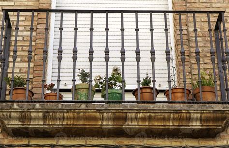 Flower pots on a balcony 8161353 Stock Photo at Vecteezy