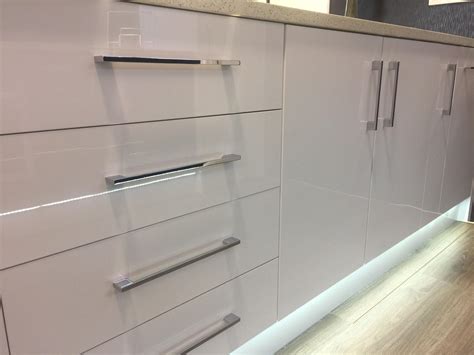 Polished Chrome handles showcased on a White Gloss Kitchen, designed and made in NZ by KRUS ...