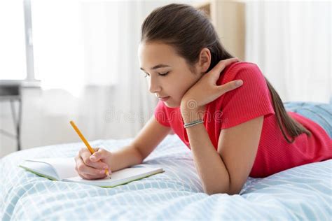 Teenage Girl Writing To Diary at Home Stock Image - Image of notebook, lying: 191372605