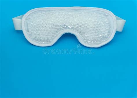 White Mask with Transparent Gel Balls Inside for Hot and Cold Aesthetic Treatment on Blue ...