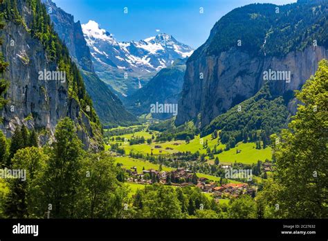 Lauterbrunnen valley, village of Lauterbrunnen, waterfalls and the Lauterbrunnen Wall in Swiss ...