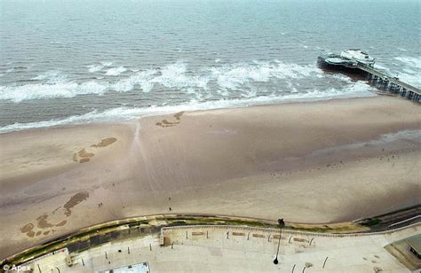 What's that coming out of the sea? Giant footprints on beach look like monster has emerged from ...