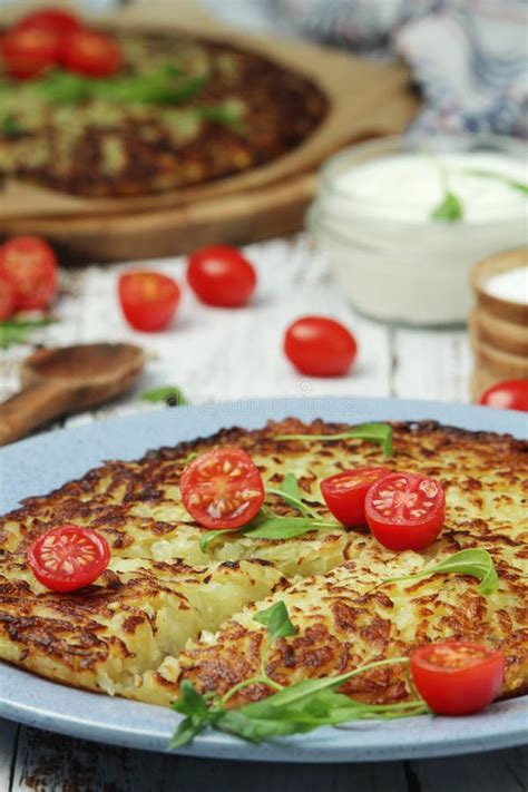 Rosti - Swiss Dish Made of Grated Potato Stock Image - Image of home ...