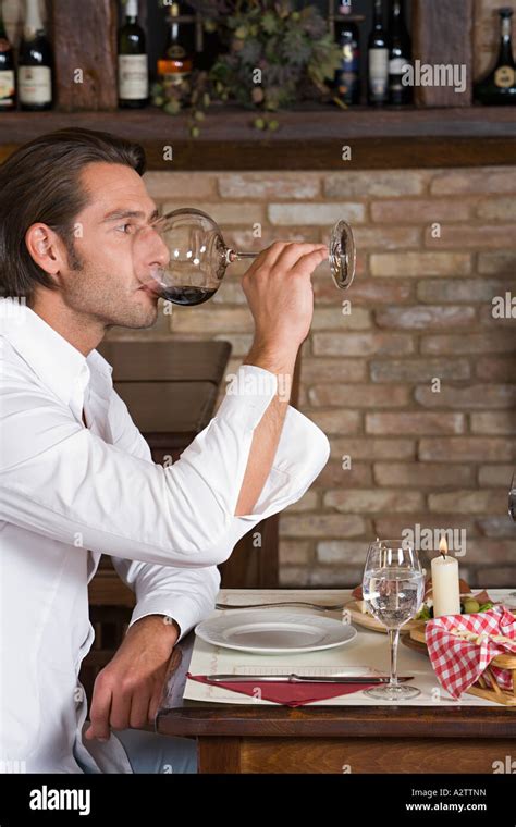 Man drinking red wine Stock Photo - Alamy