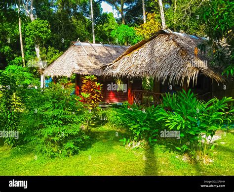 Tropical beach houses in Thailand Stock Photo - Alamy