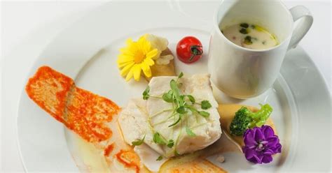 Confit fillet of Norwegian SKREI® with and mashed garbanzo beans and seasonal vegetables ...