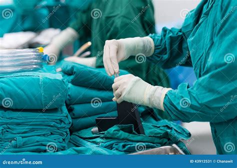 Nurse With Surgical Scissors And Doctor Staring At Patient Pelvis Stock Photo | CartoonDealer ...