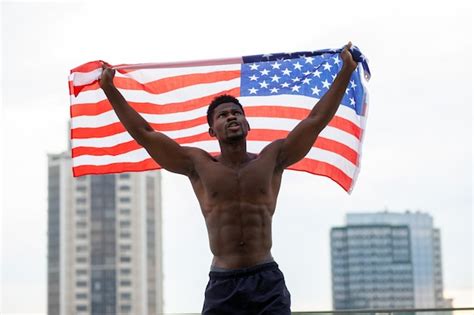 Premium Photo | African american man with usa flag protests and shouts ...