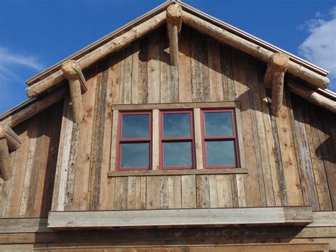 Rustic Wood Hub's reclaimed barn siding adorns this gable. | Barn ...