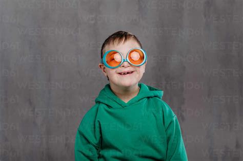 Funny portrait of a little boy with down syndrome, studio shoot. stock ...