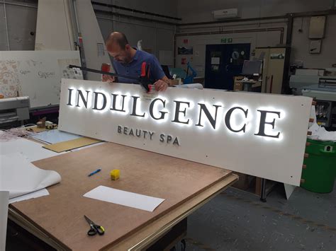 LED illuminated sign in the workshop | Exterior signage, Wayfinding signage, Backlit signs