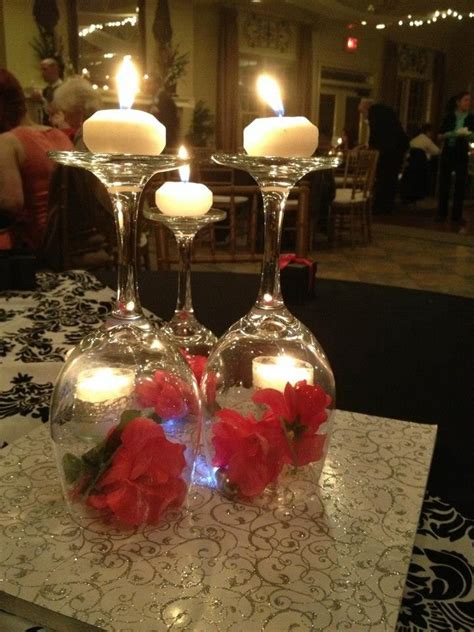 Upside down wine glass centerpieces for a Christmas wedding | Glass wedding centerpieces, Wine ...