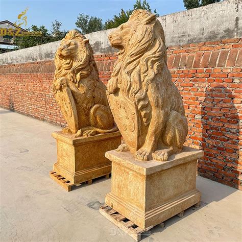 Antique sitting lion with shield marble statue