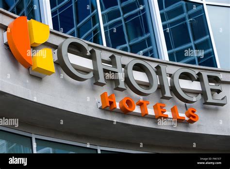 A logo sign outside of the headquarters of Choice Hotels International ...