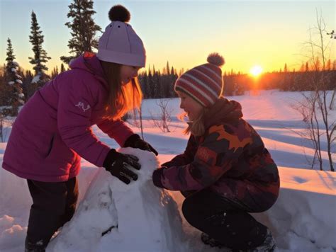 Premium AI Image | Kids building a snowman in winter day