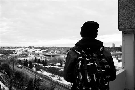 man, standing, balcony, black, white, rooftop, daytime, guy, backpack, hat | Pxfuel