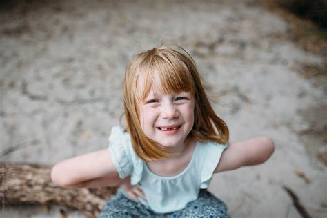 "Portrait Of A Little Girl Missing Her Two Front Teeth" by Stocksy Contributor "Amanda Voelker ...