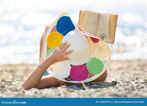 The Girl Lies on the Beach with a Book Stock Photo - Image of book, caucasian: 157827414