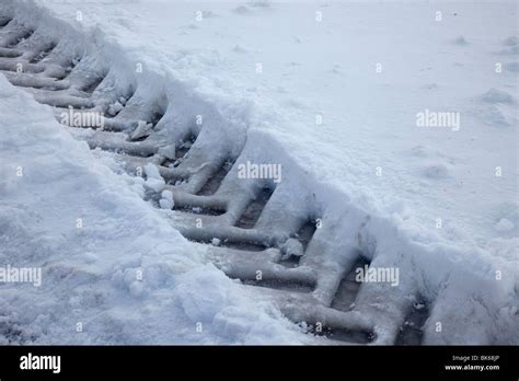 Tractor Tyre Tracks in deep Snow, UK Stock Photo - Alamy