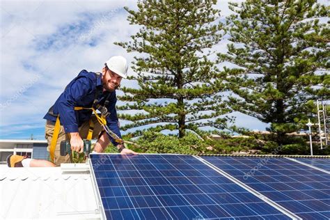 Solar panel technician Stock Photo by ©zstockphotos 90735628