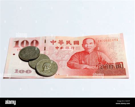 Taiwan dollar banknote and coins Stock Photo - Alamy