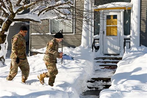 Winter storm in Buffalo: Crews work to clear snow-covered roads and go ...