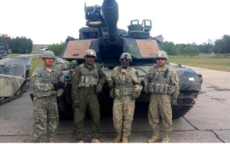 Stepping up; female mechanic loads tank during gunnery | Article | The United States Army