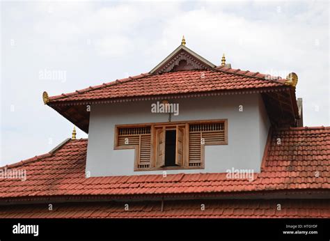 Traditional architecture of a tiled roof house in Kerala, using Stock Photo: 135597099 - Alamy