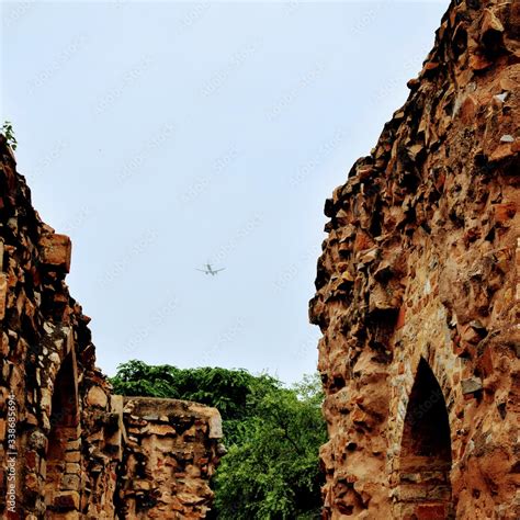 Inside the Qutub Minar Complex with antic ruins and inner square ...